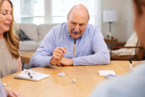 Elderly gentleman playing games at home
